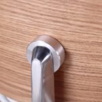 Close-up of the round handle on the Eames lounge chair ottoman