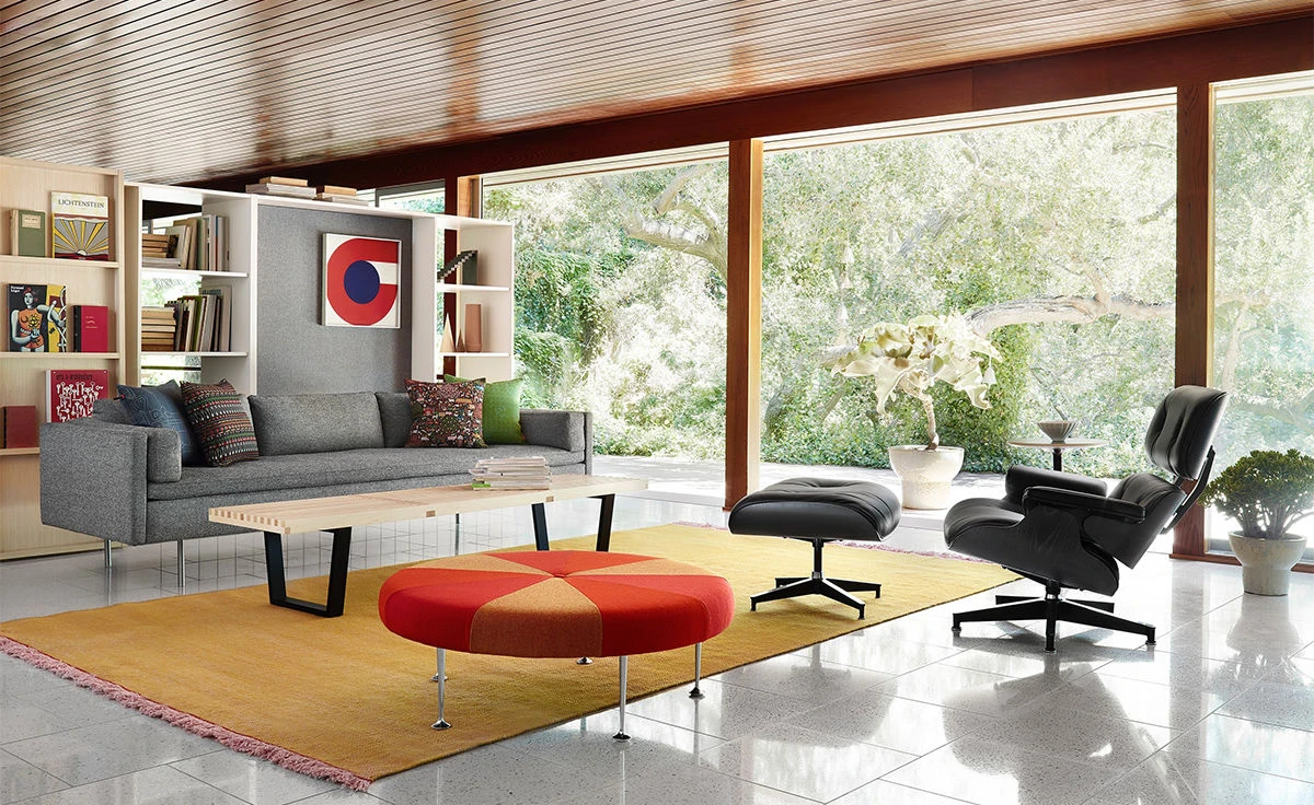 All black Eames lounge chair and ottoman styled in a modern luxury living room