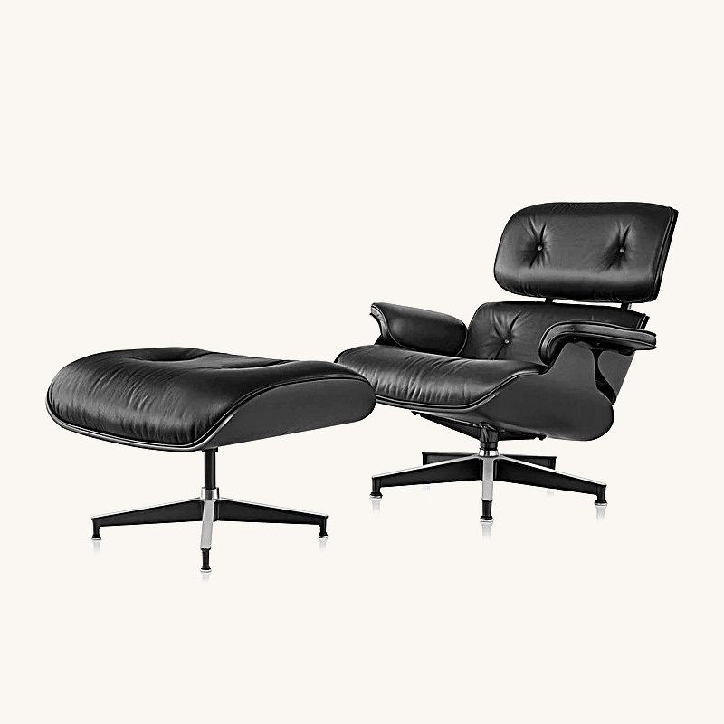 All black eames lounge chair and ottoman replica in ebony ash and dark aniline leather.