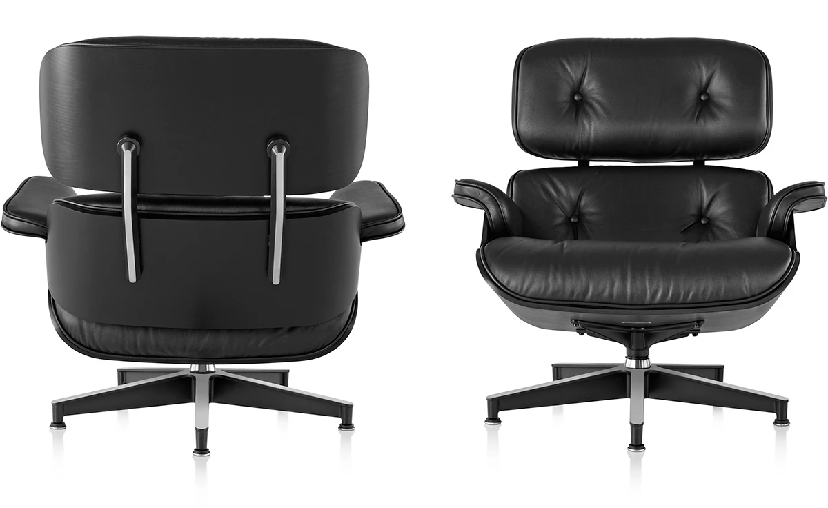 Back view of the black Eames lounge chair and ottoman, ebony ash veneer shell