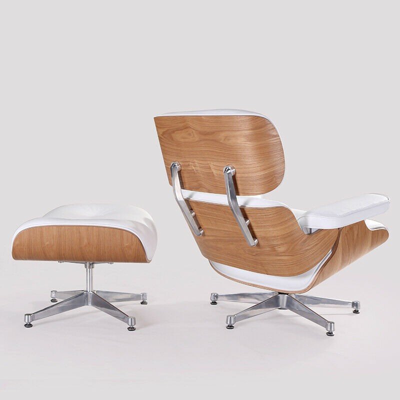 Back view of the white Eames lounge chair and ottoman, ash wood shell and chrome base