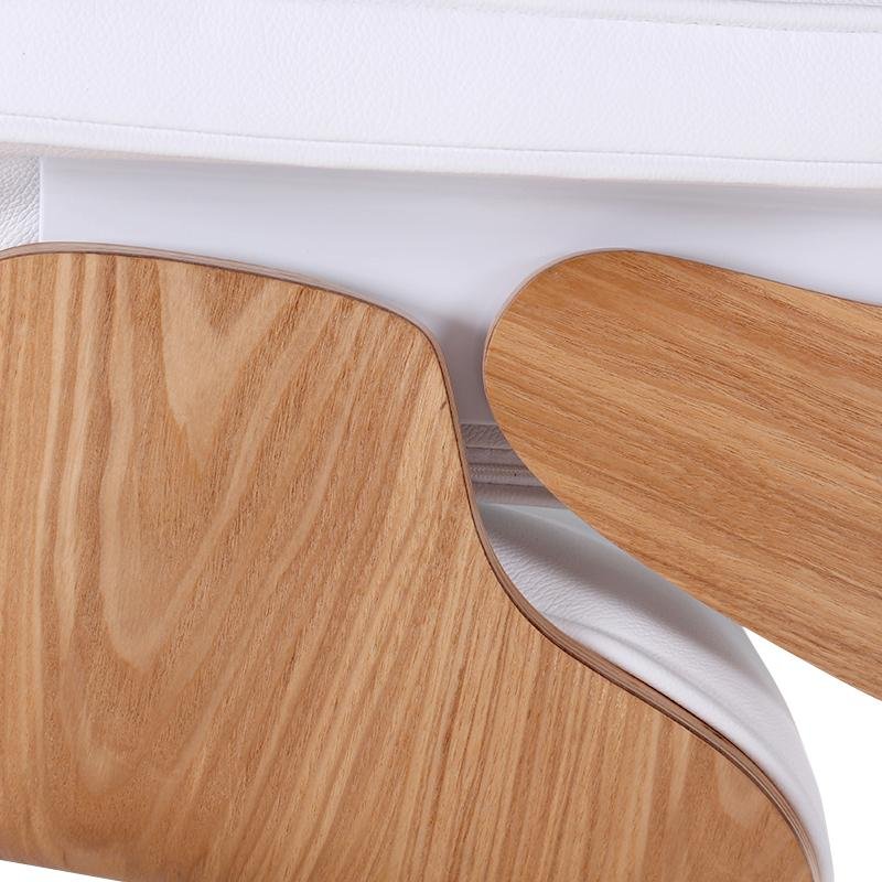 Close-up of the light ash veneer grain on the back of the Eames lounge chair shell