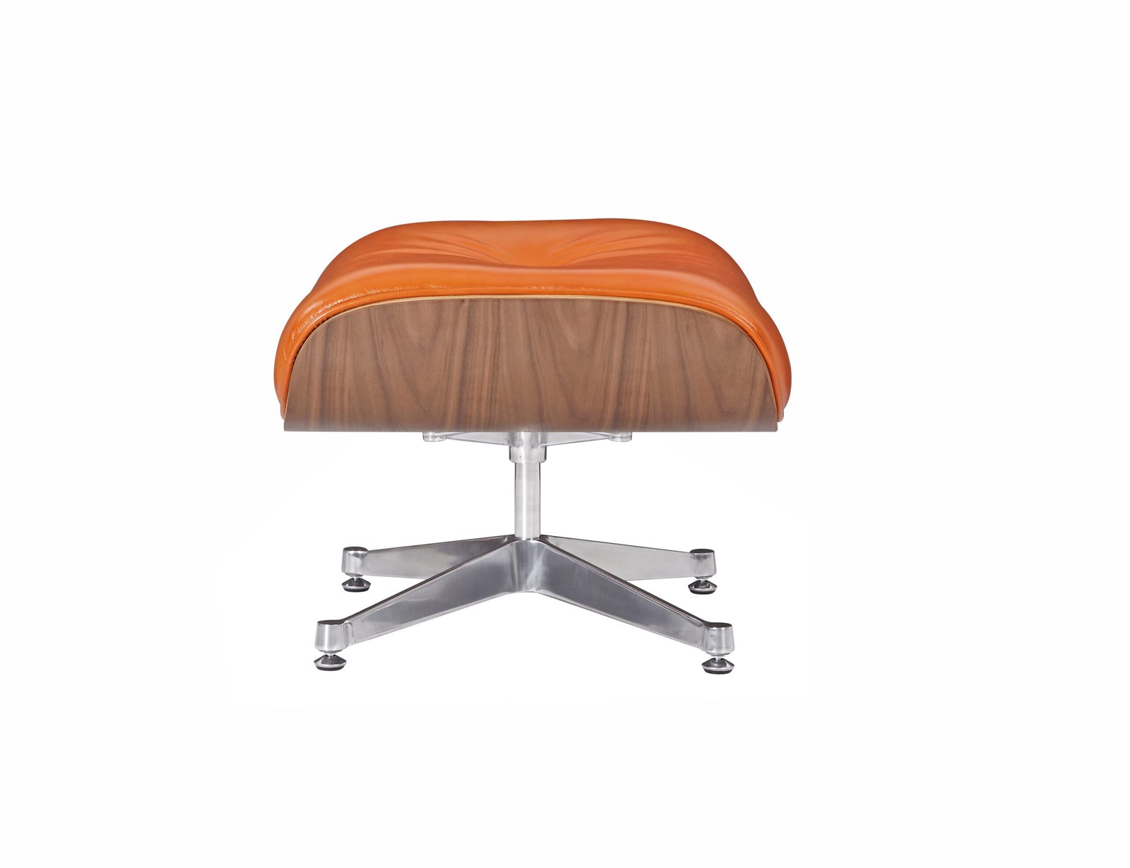 Close up of the tufted camel leather cushion on the reproduction eames lounge chair and ottoman.