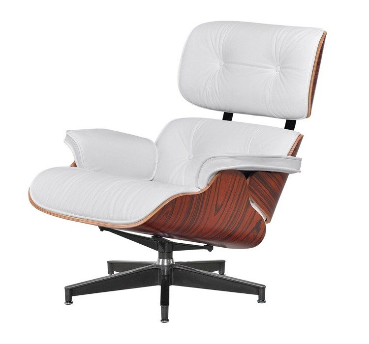 Front angle of the white eames lounge chair showcasing the tufted cushions and wide armrests.